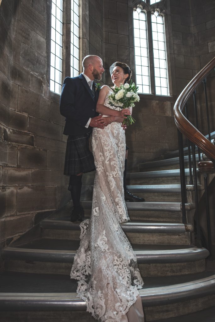 bride and groom on staircase