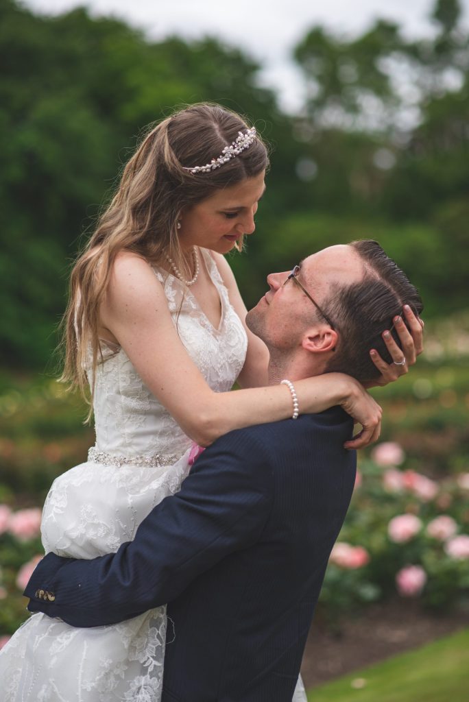 Bride and Groom lift for wedding photoshoot at Hazelhead Park