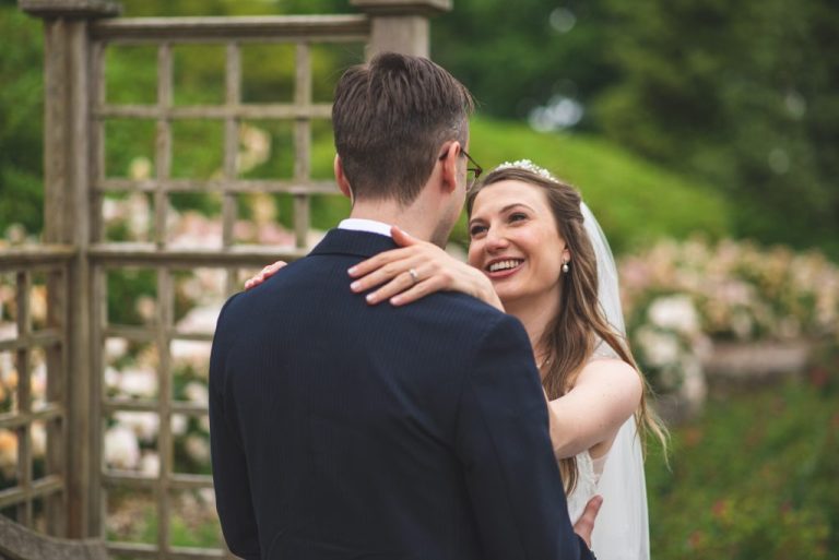 Bride smiling at Groom for their wedding photographs, in Hazelhead Park Aberdeen